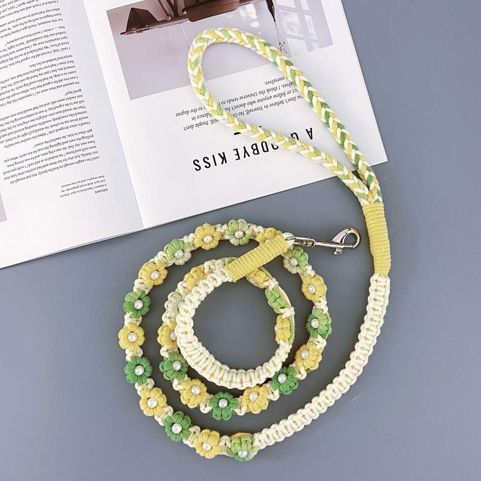 Close-up of woven floral handle on braided dog leash